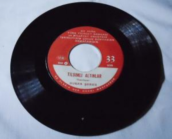 NURAN ŞENER A-YARAMAZ TAVŞAN B-TILSIMLI ALTINLAR 45 LİK PLAK MASAL 