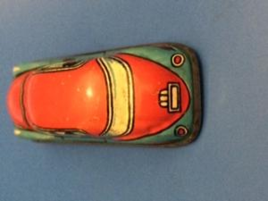 RAYDA GİDEN KURMALI TENEKE AMERİKAN OYUNCAK OTO