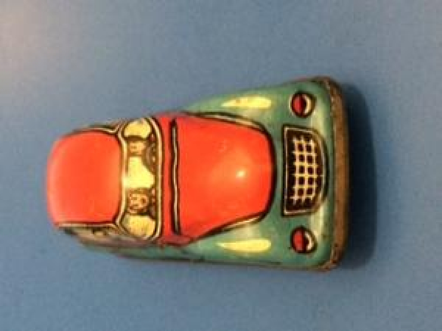 RAYDA GİDEN KURMALI TENEKE AMERİKAN OYUNCAK OTO