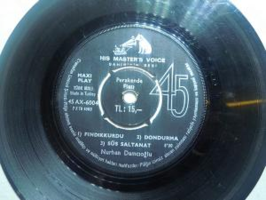 MİNİ LP NURHAN DAMCIOĞLU 1) KABAĞI DA BOYNUMA TAKARIM ; 2) EBEGÜMECİ;SÖZ VE MÜZİK : FEHMİ EGE ; 1) FINDIKKURDU ; 2) DONDURMA ; 3) SÜS SALTANAT NURHAN DAMCIOĞLU 45'LİK YERLİ PLAK 