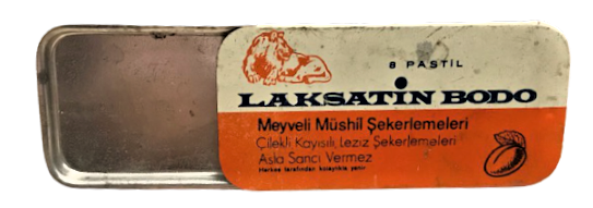  LAKSATİN BODO MEYVELİ MÜSHİL ŞEKERLEMELERİ TENEKE SURGULU KAPAK İÇERSİNDE 2 ADET PASTİL MEVCUTDUR