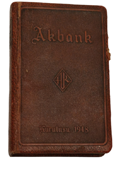 AKBANK MERKEZ BİNASI GÖRSELLİ KİTAP FORMUNDA ÜZERİ DERİ KAPLI SERİ NUMARALI YURT DIŞINDA YAPTIRILMIŞ KUMBARA
