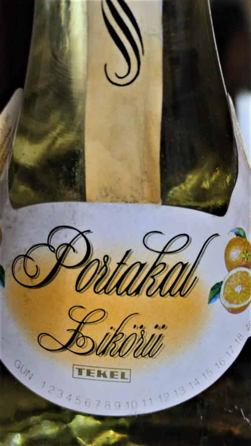 1990 TEKEL PORTAKAL LİKORU ACILMAMIŞ KAPALI  ARMUT FORMLU TEKEL YAZILI CAM ŞİŞESİNDE