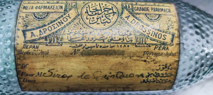 OSMANLI  A.DİRİNOS ECZANE İ KEBİR 25 LİK RAKI ŞİŞESİNDEN ECZA ŞİŞESİ ÖZEL EL YAPIM İLAC KOYULMASI İÇİN ÜC DİLDE YAZILMIŞ ORJINAL ETİKETLİ