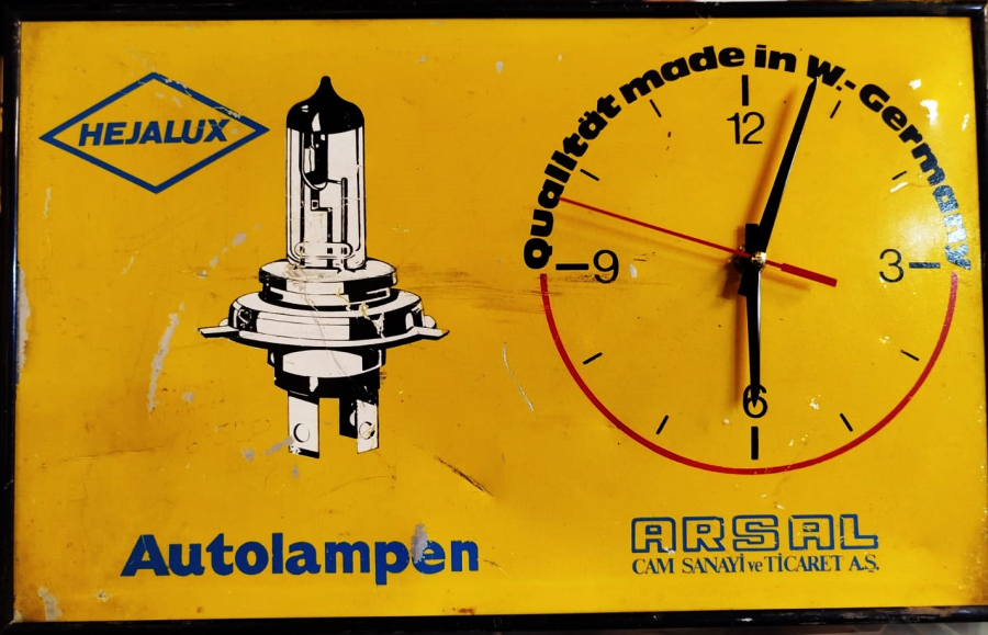 HEJALUX AUTOLAMPEN ARSAL CAM SANAYİ VE TİCARET AS OTO LAMBA REKLAMLI TENEKE DUVAR SAATİ