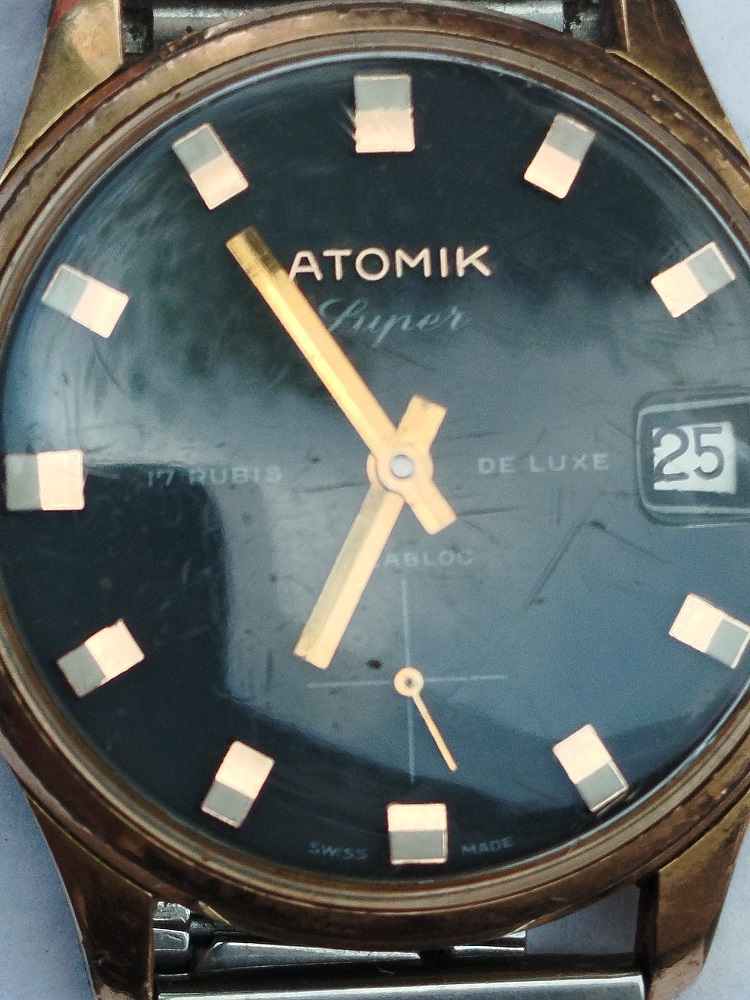 ATOMİK 17 RUBIS DELUXE INCABLOC TAKVİMLİ KURMALI KOL SAATİ METAL KORDON DAKİK CALISMAKTA