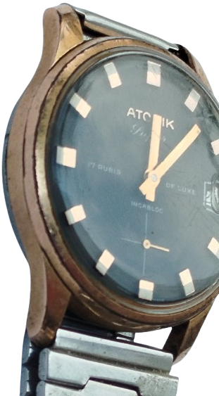 ATOMİK 17 RUBIS DELUXE INCABLOC TAKVİMLİ KURMALI KOL SAATİ METAL KORDON DAKİK CALISMAKTA