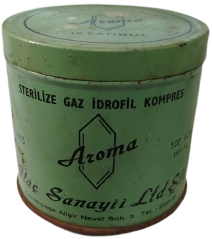 1960 AROMA İLAÇ SANAYİİ LTD. ŞTİ. MARKALI STERİLİZE GAZ İDROFİL KOMPRES  TENEKE KAPAKLI KUTU